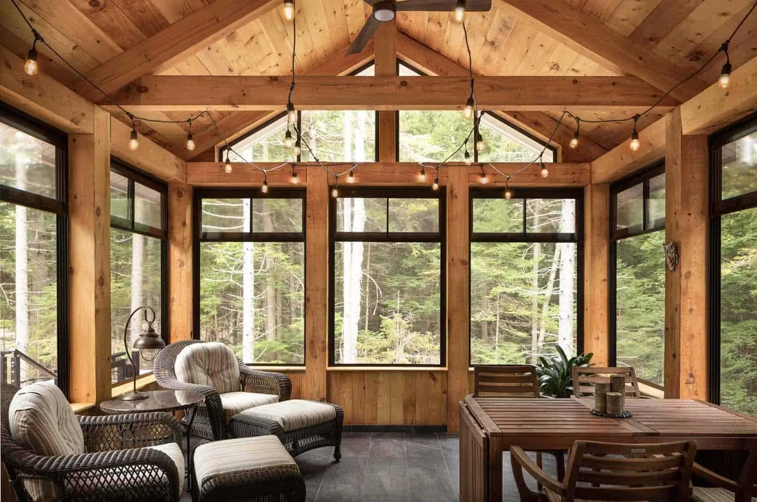 Sunroom with wood walls and large windows