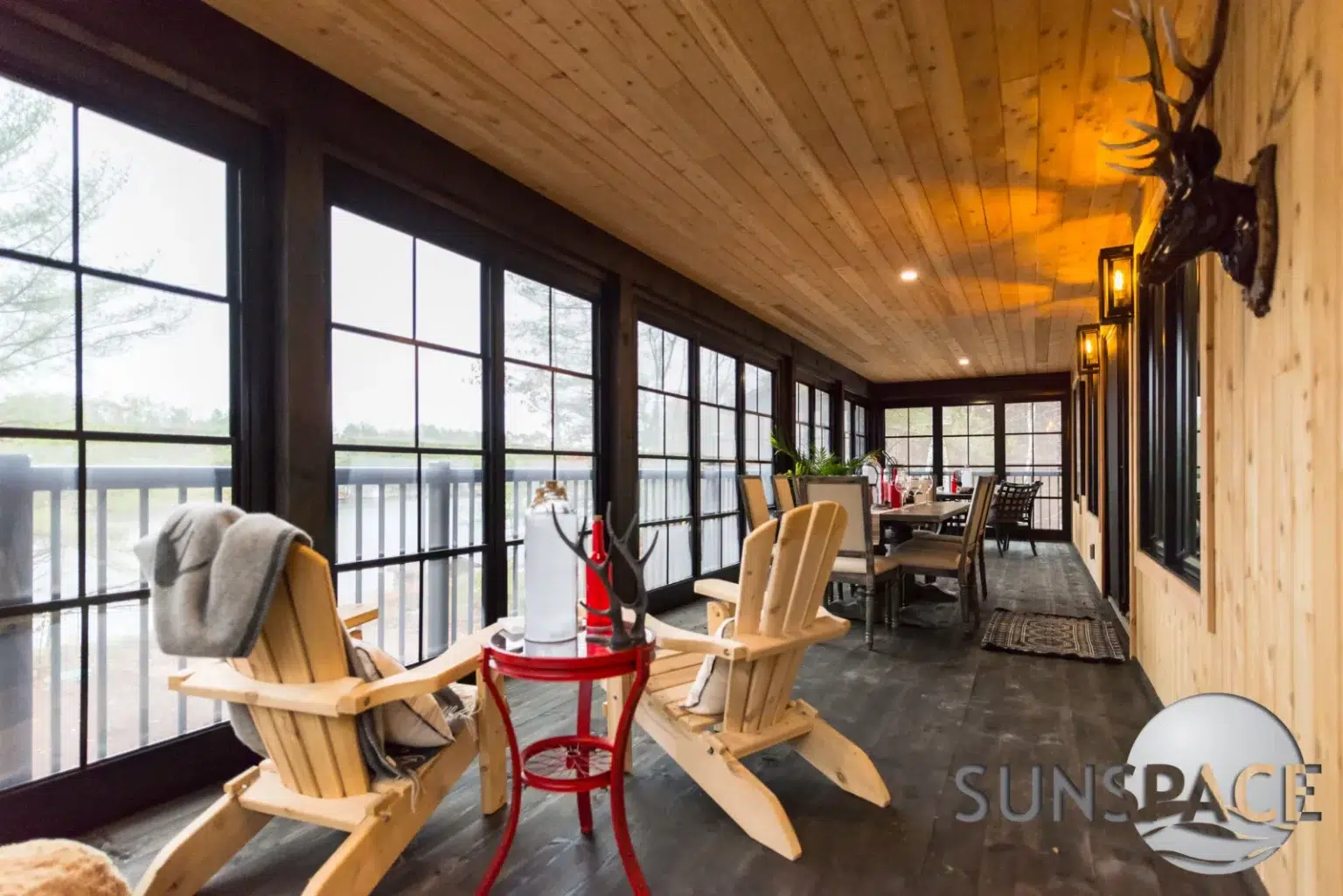 A cozy porch featuring two chairs and a small table, inviting relaxation and outdoor enjoyment.