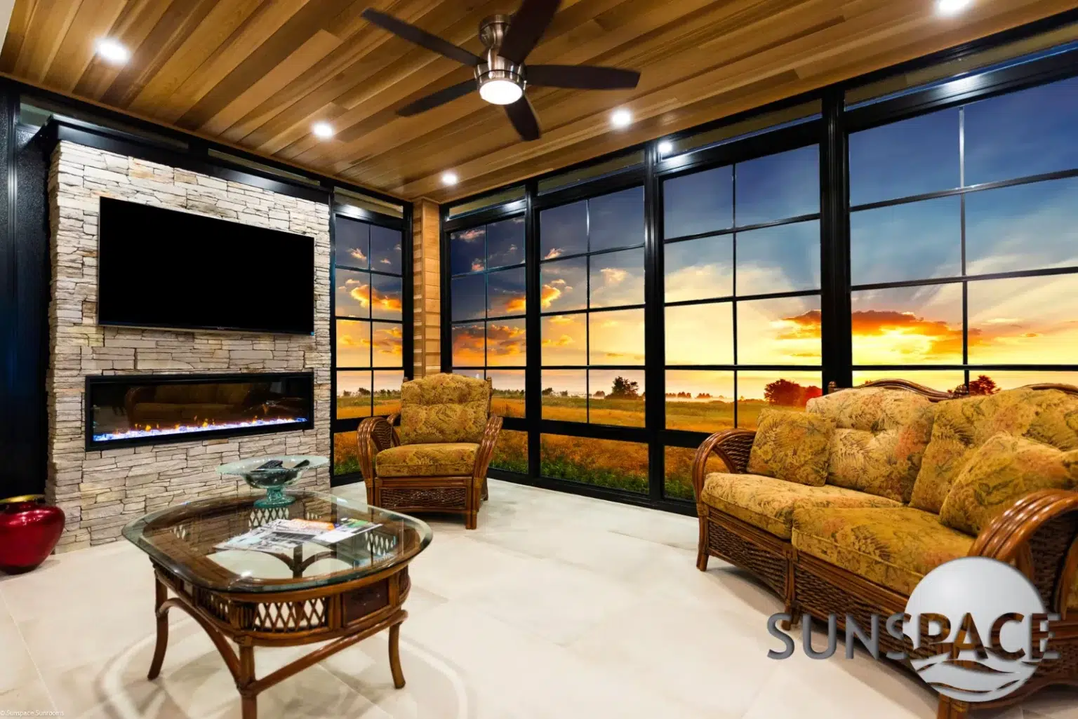 Cozy Sunspace living room with large windows and natural decor